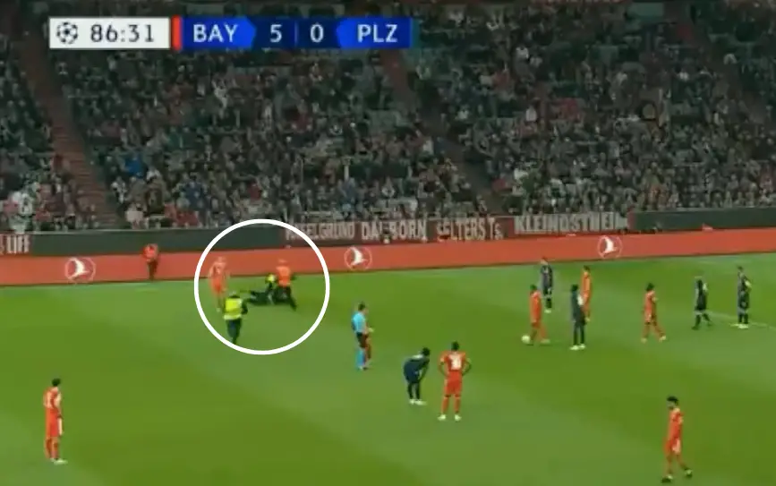 WATCH: Pitch invader gets FLOORED by security after storming the pitch