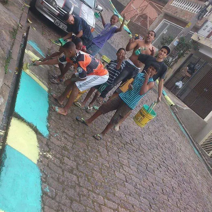A young Gabriel Jesus pictured painting curbs in Brazil with local friends.