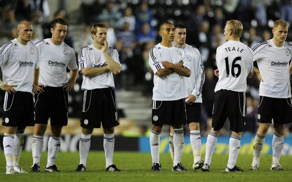 Derby County players facing the fans after Premier League relegation.