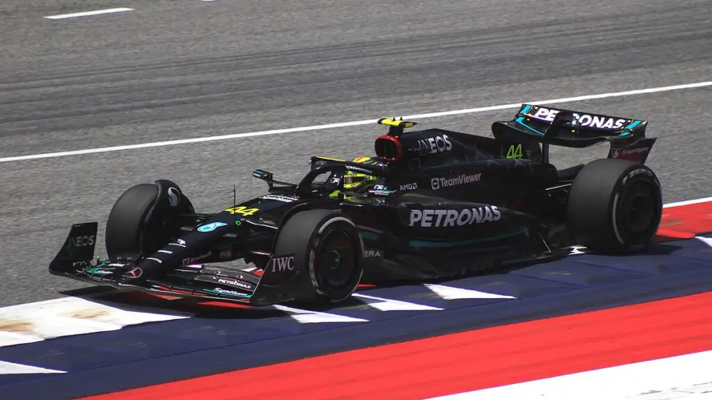 Lewis Hamilton driving Mercedes F1 car around the Austria circuit.